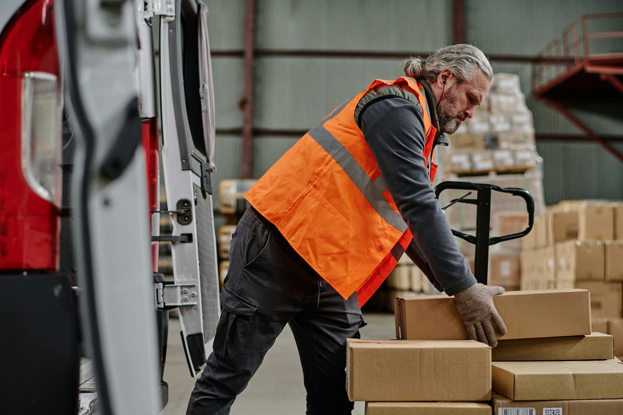 Worker loading cargo in truck